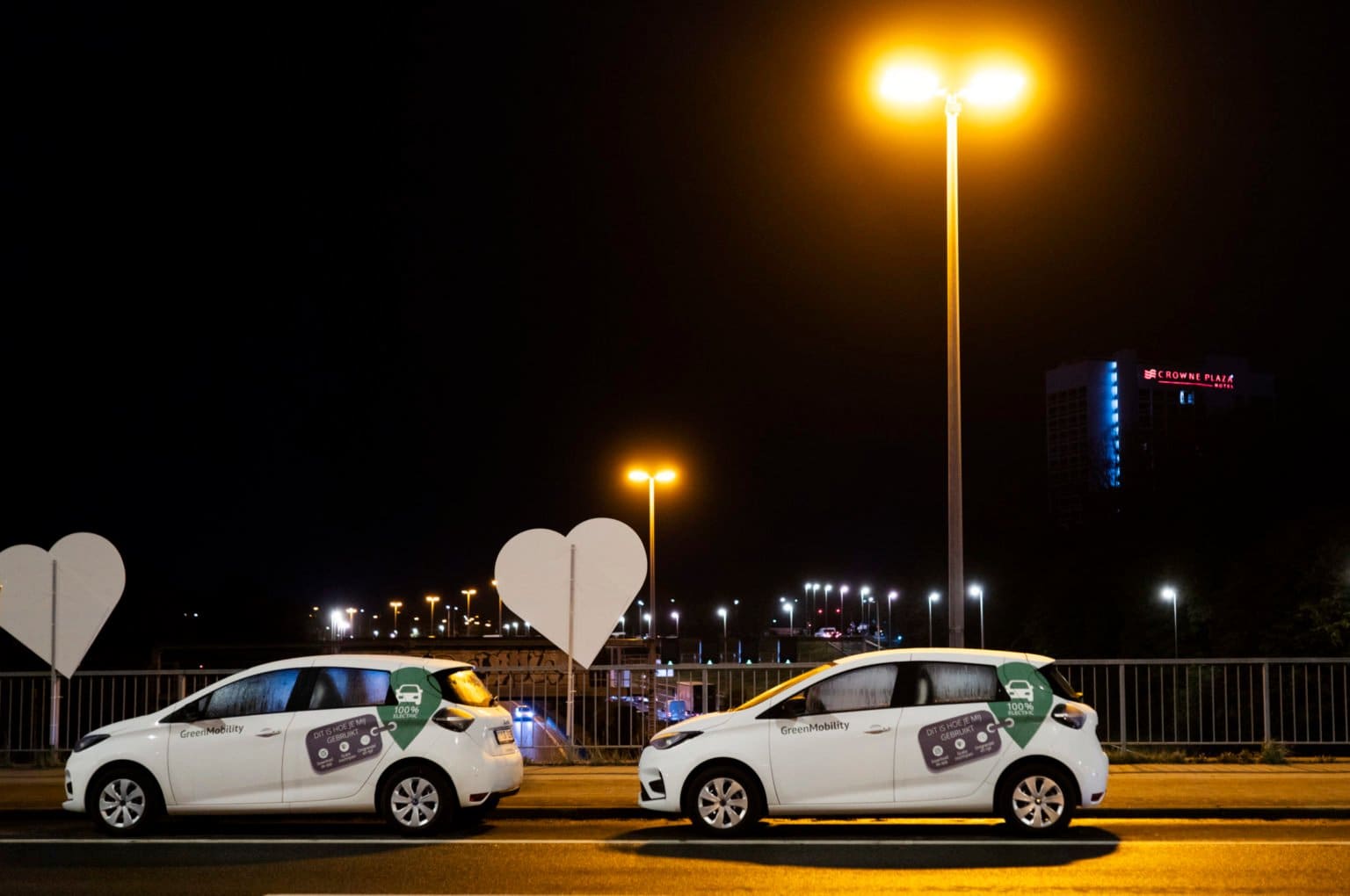 GreenMobility cars in a row at night